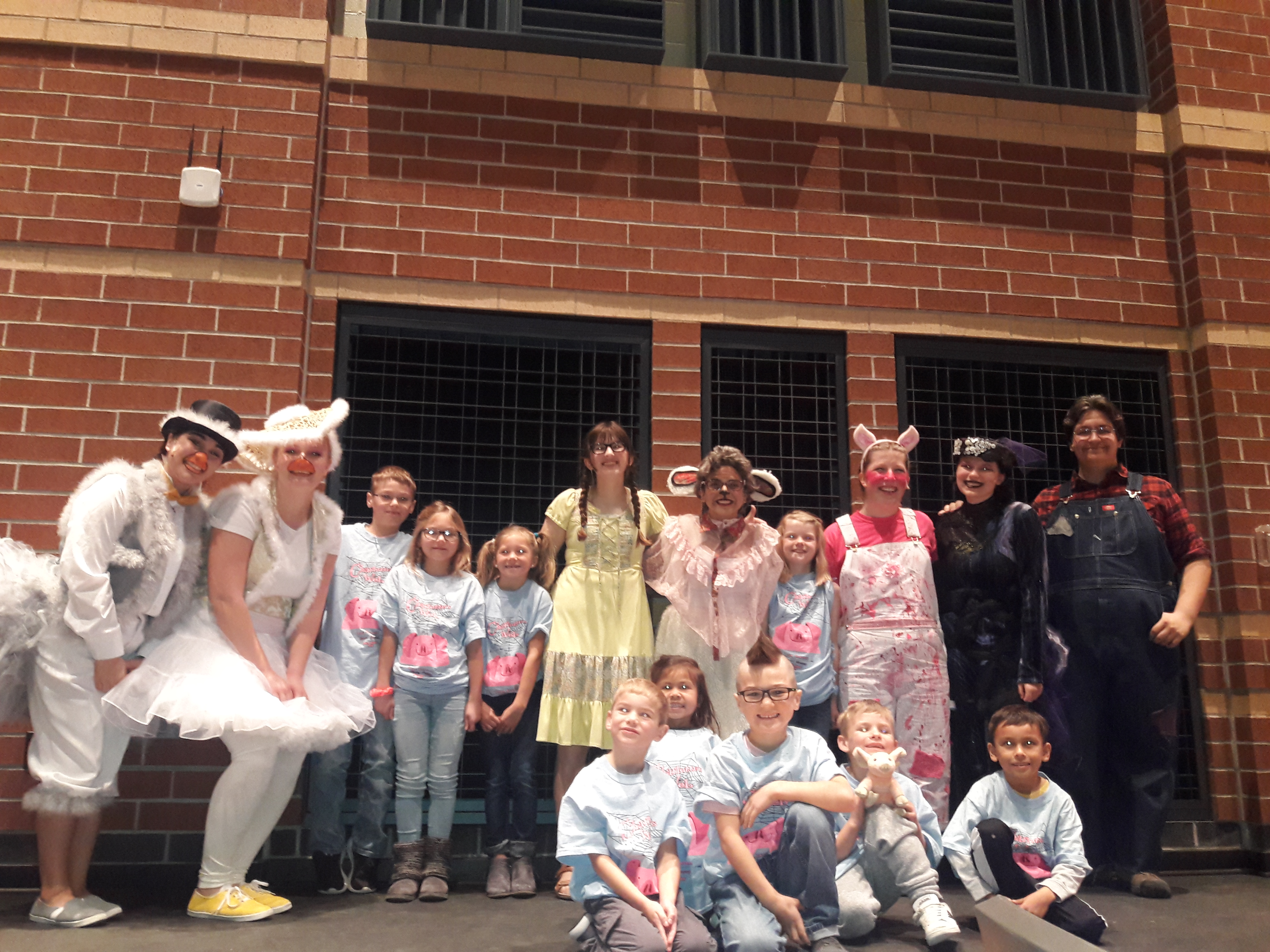 Kolling family challenge winners with cast members from LCHS Theatre Group at the Charlotte's Web performance