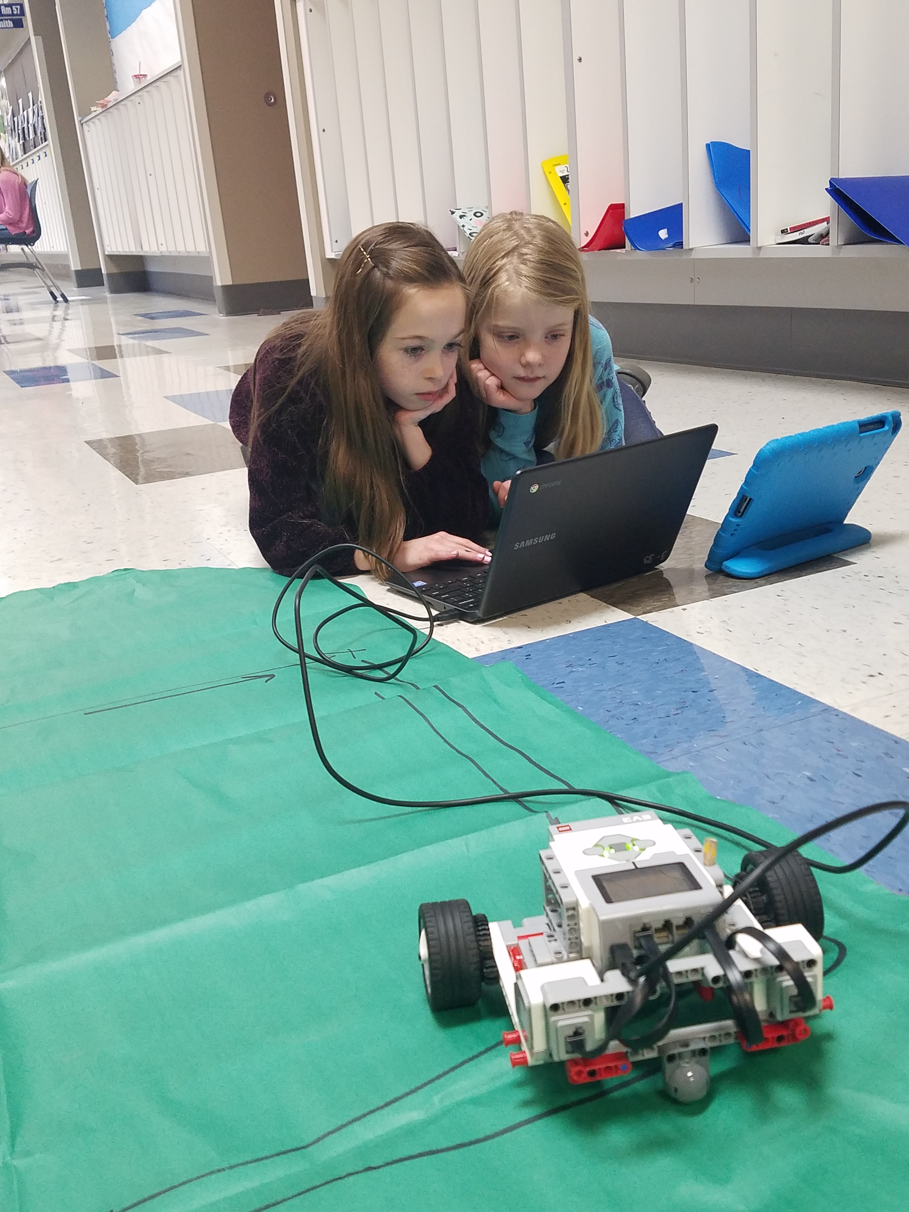 4th Grade students show off their robotics project.