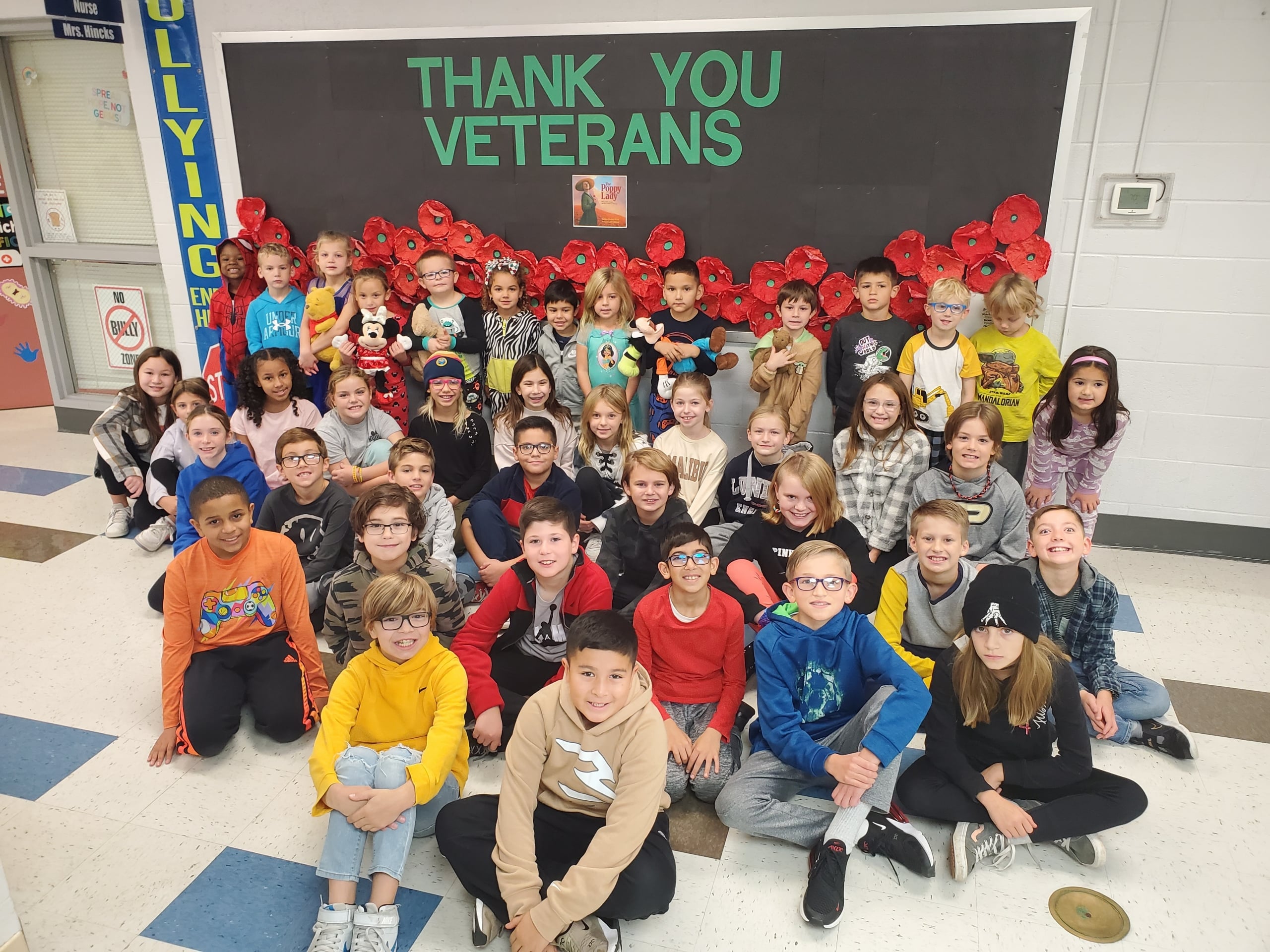 Mrs. Vogt's 4th graders team up with Mrs. Sanders' KDG students work together to learn the story of "The Poppy Lady" and support of for our Veterans.
